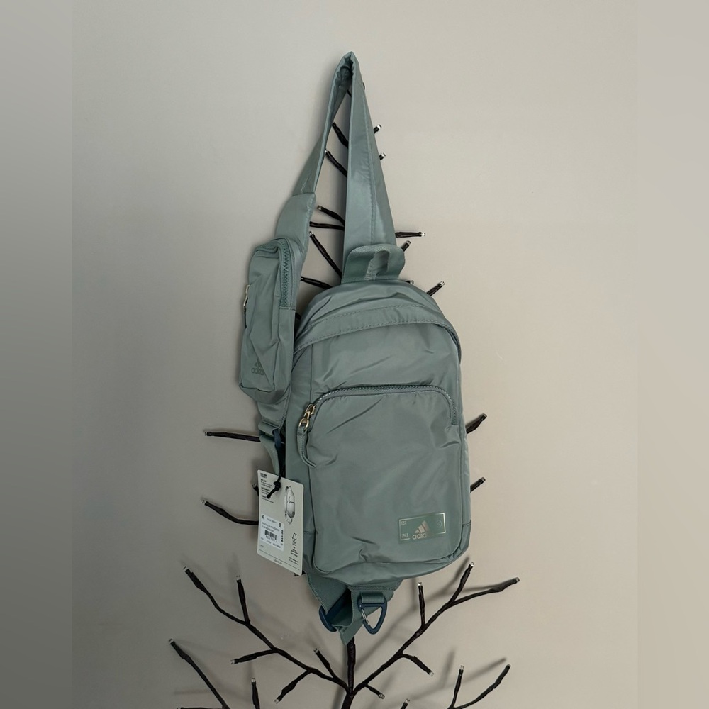 Brand new”Adidas”Unisex sling crossbody bag.Size-w8.5”x13.5”inc.(Silver green)💚